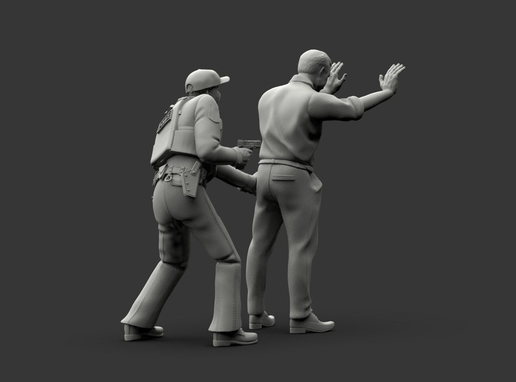 MM1225 Policeman Patting Down Armed Suspect