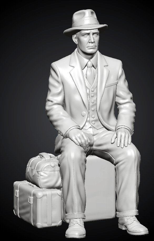 MM1495 Seated Gentleman on Suitcase with Fedora