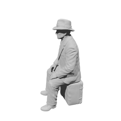 MM1494 Seated Gentleman in Suit and Fedora with Stacked Luggage