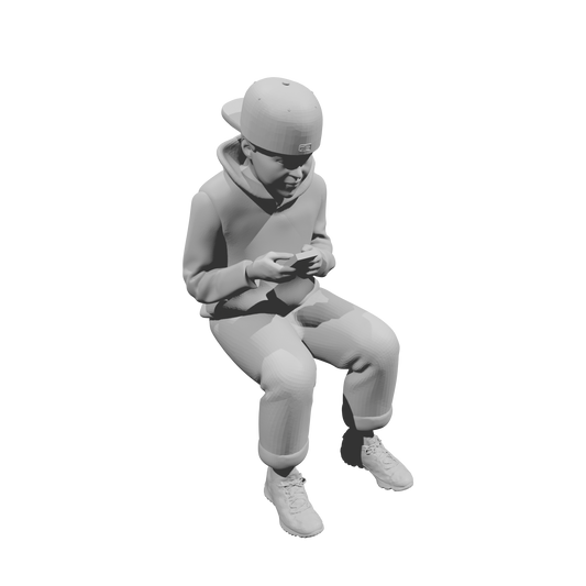 MM519Seated Boy in Hoodie Using Smartphone