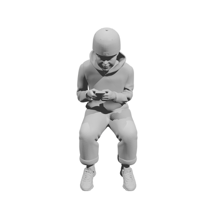 MM519Seated Boy in Hoodie Using Smartphone