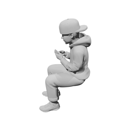 MM519Seated Boy in Hoodie Using Smartphone