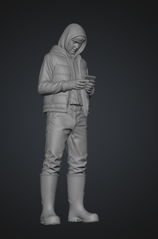 DG012 Farmer boy texting in the cold