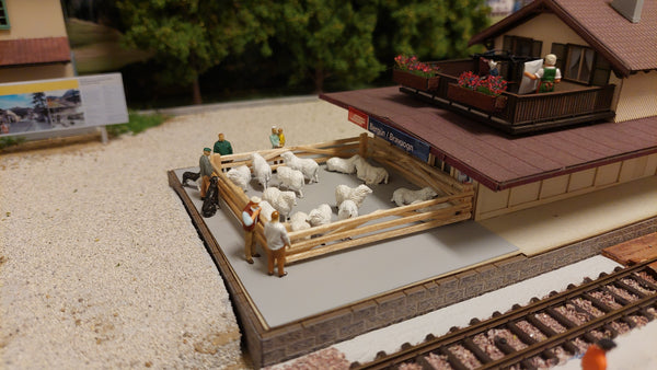a scene from my Rhaetian Railway H0m layout that portrays Berguen station in Switzerland in the 90's. Back then they still transported livestock by rail, and had sheep pens at the station (the second picture was taken in 1997)