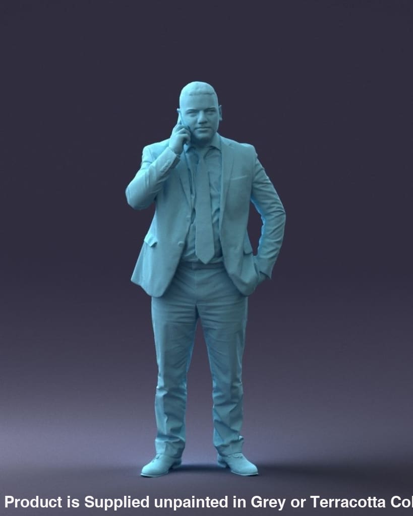 Older Male In Suite On Mobile Phone Figure